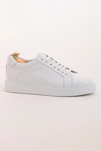 Pristine Luxe White Leather Sneaker - Luxury Comfort for Every Occasion – side profile of one shoe, showcasing 100% genuine leather and a lightweight EVA sole.