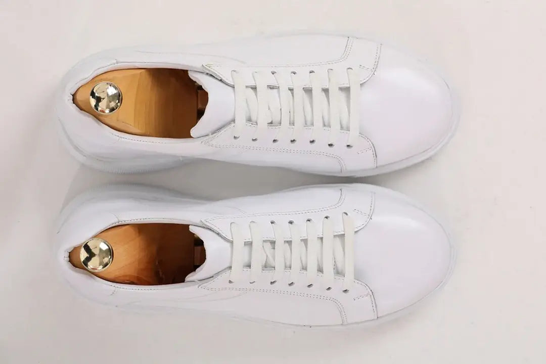 Pristine Luxe White Leather Sneakers - Luxury Comfort for Every Occasion – top-down view of pair, emphasizing 100% genuine leather and a sleek, minimalist design.