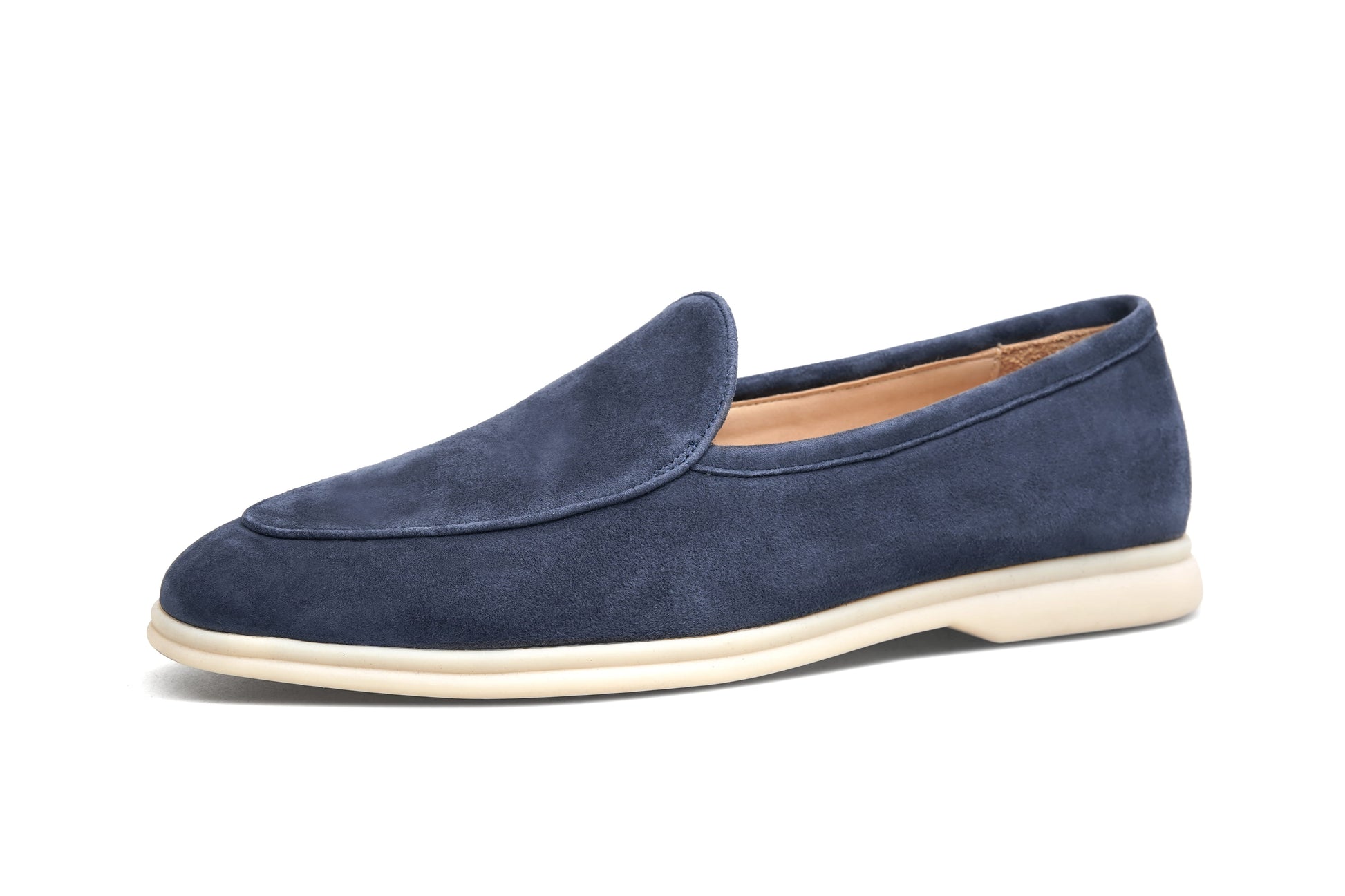 Single navy blue suede Venetian loafer on white background, side profile