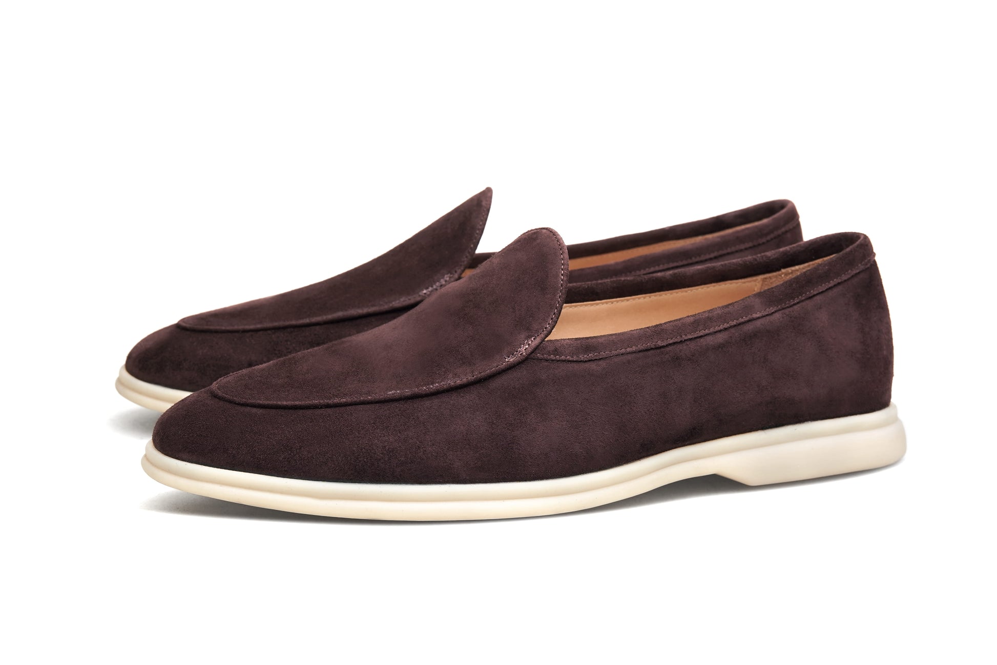 Pair of coffee-brown suede Venetian loafers on white background, heel and sole view