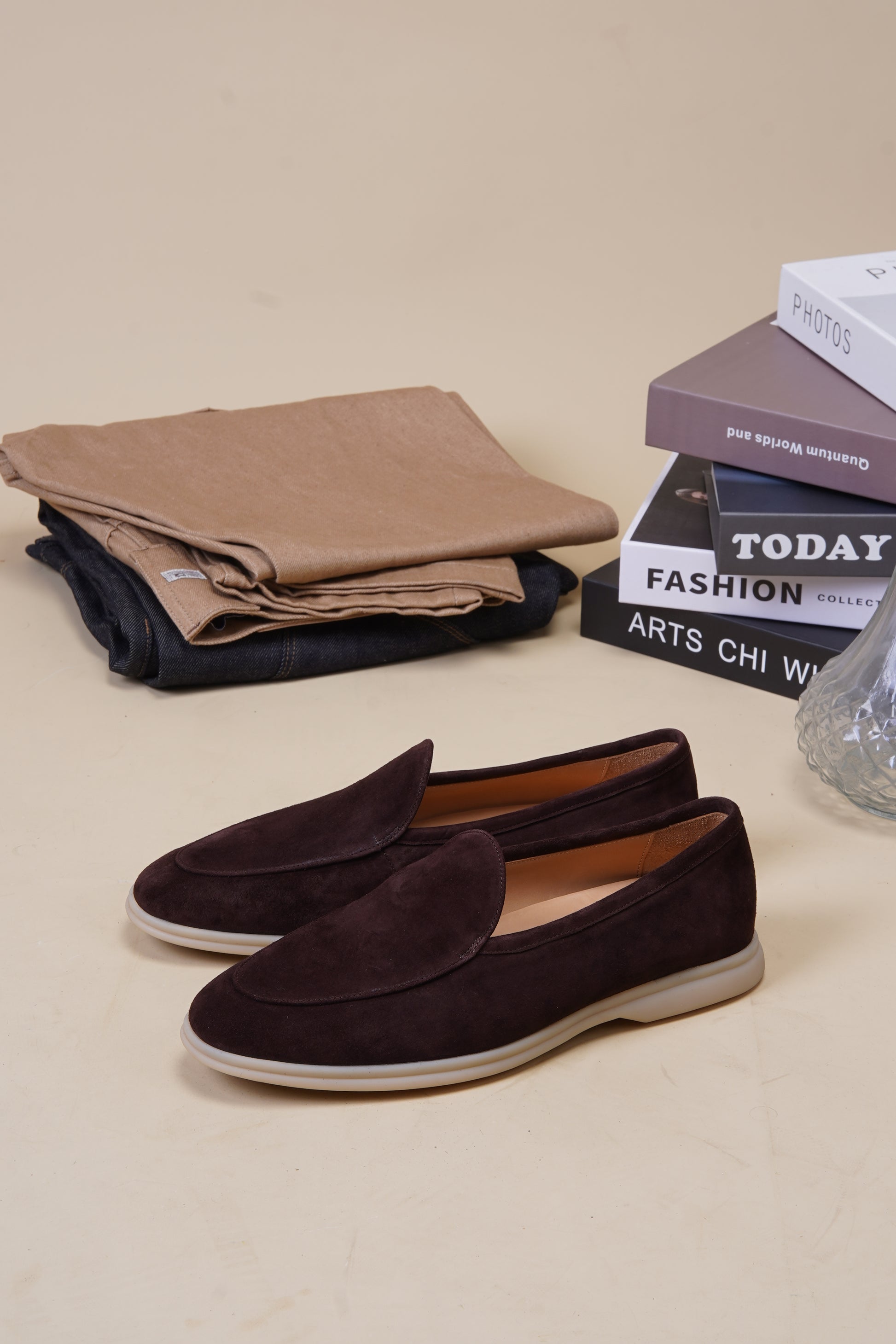 Siena rich coffee-brown suede Venetian loafers with folded fabric and books, angled pair
