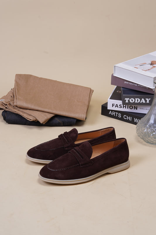 Riviera espresso-brown suede penny loafers with penny keeper strap and books, angled pair