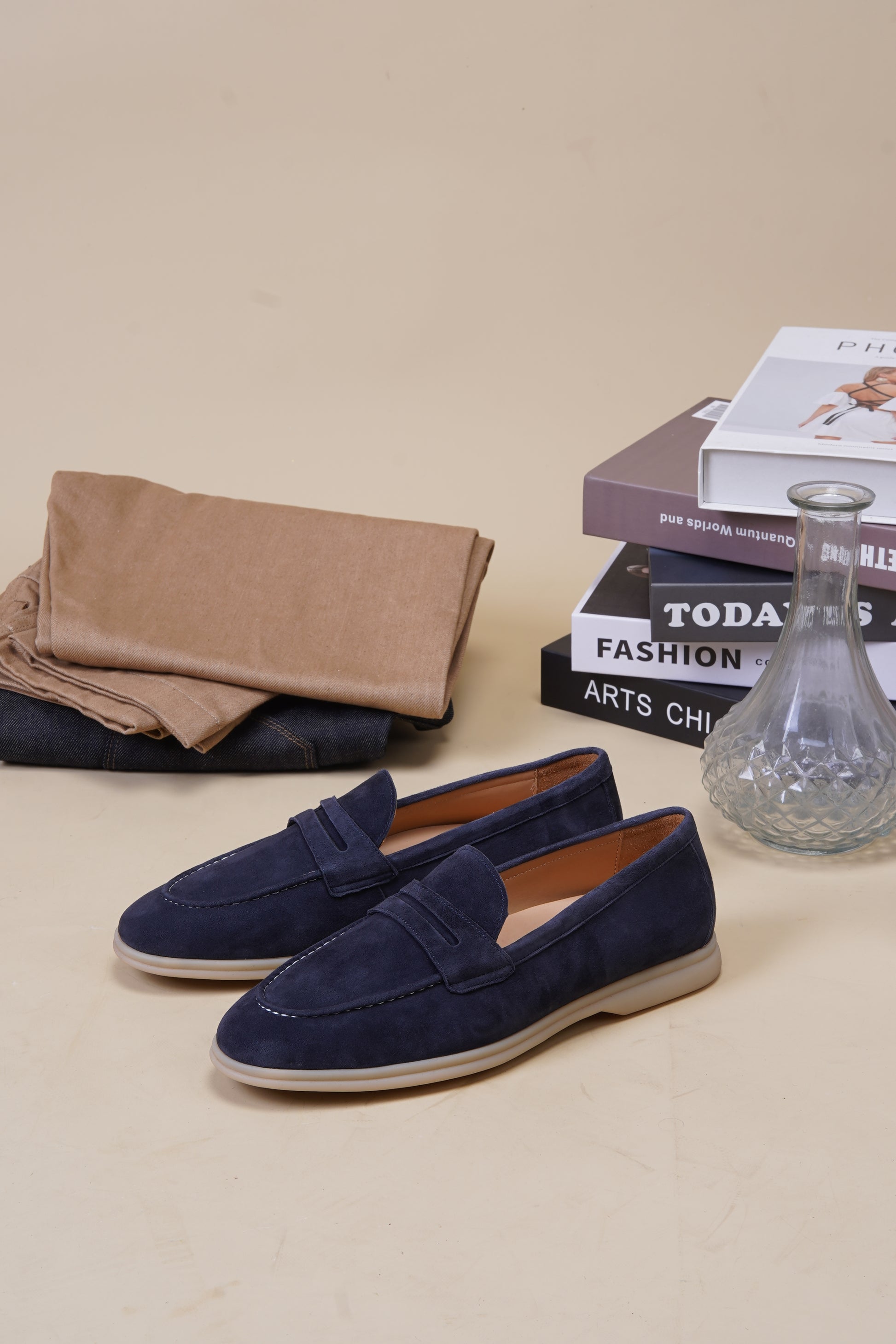 Sorrento navy blue suede penny loafers with penny keeper strap, angled pair view