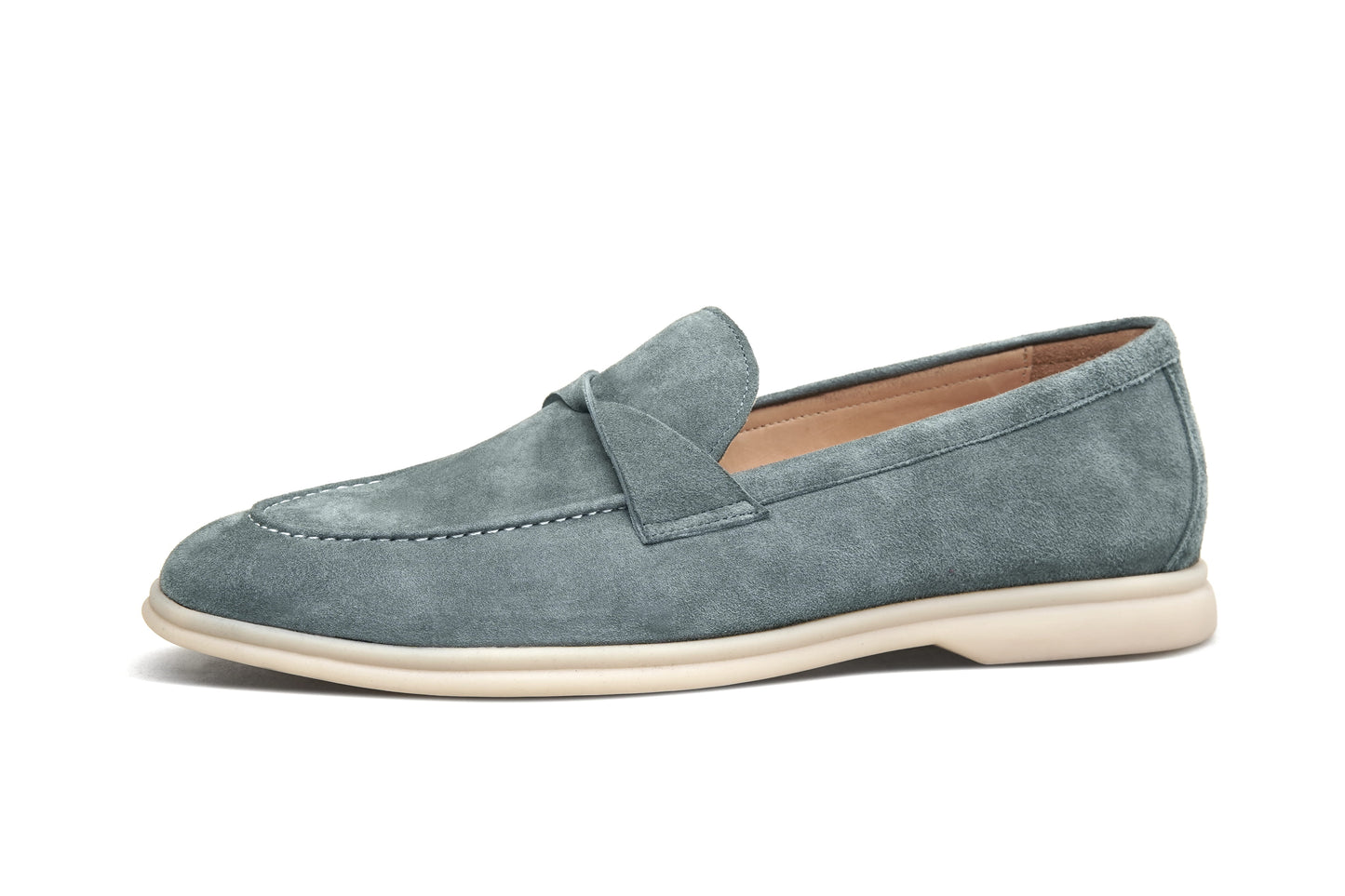 Single green suede twist-strap loafer on white background, side profile