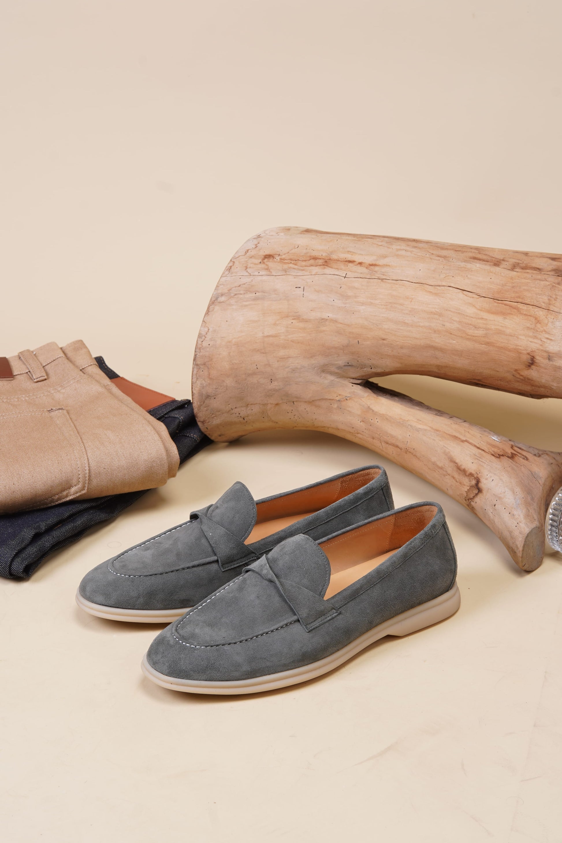 Verona green suede twist-strap loafers with crossover vamp strap, angled pair view