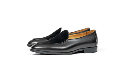 Velvet Crest Black Leather Suede Loafers – pair on a white background, highlighting the contrast in textures for refined ease and modern polish.