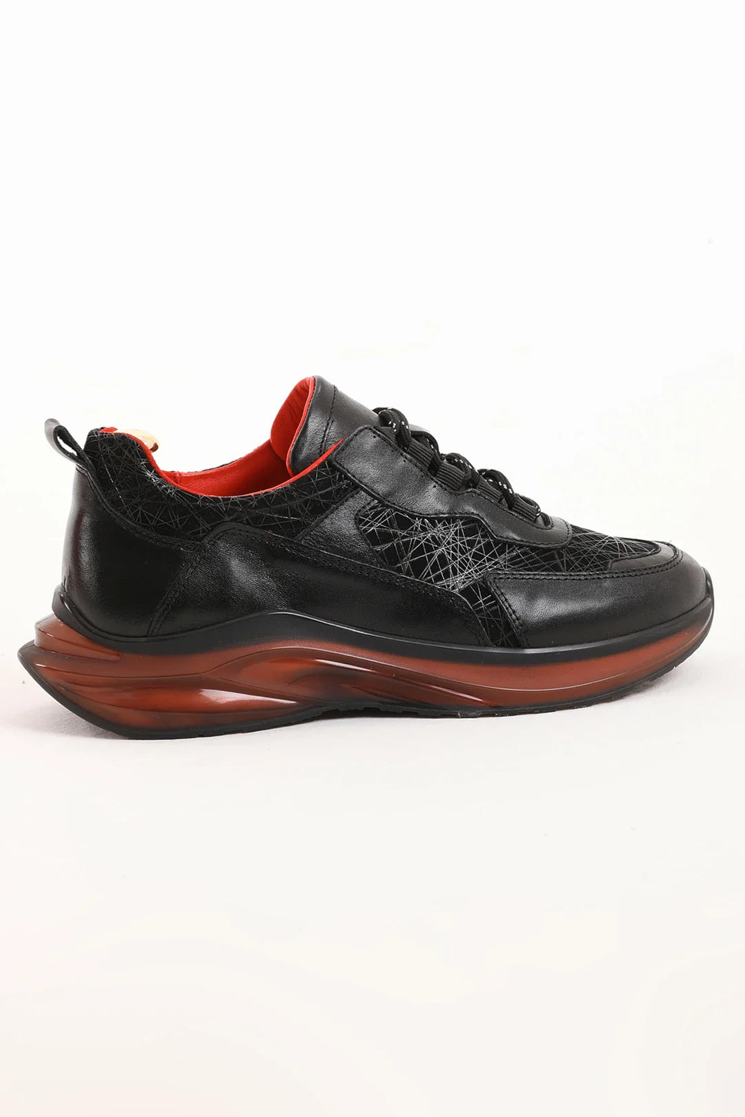 Midnight Raven Luxe Sneaker with premium black leather and red sole accents for men. 