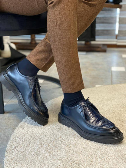 Dark Blue Crocodile Leather Derby Shoes – worn by a man in brown trousers, standing on a white rug, showcasing the lasting style and comfortable fit.