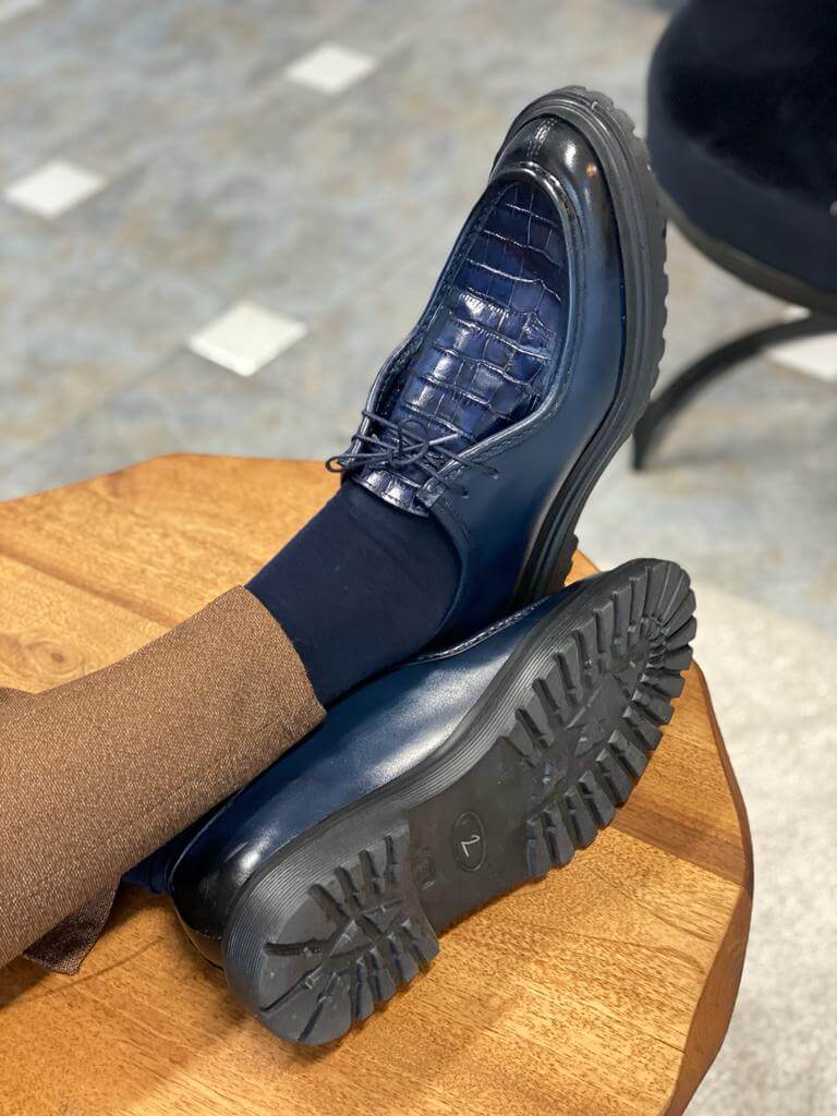 Dark Blue Crocodile Leather Derby Shoe – side view, worn by a man in brown trousers, highlighting crocodile pattern and textured sole.