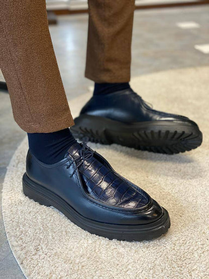 Dark Blue Crocodile Leather Derby Shoes – worn by a man in brown trousers, with one foot elevated, highlighting the unique textured leather and durable sole.