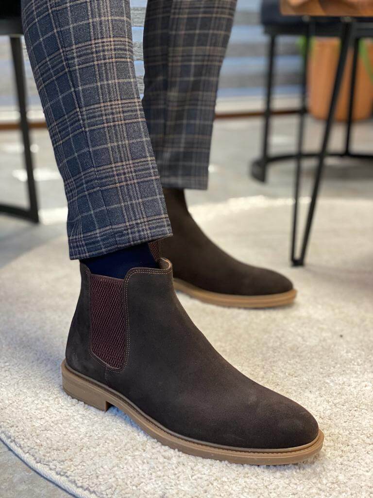 Handmade Brown Suede Leather Chelsea Boots – a man wearing brown suede Chelsea boots with patterned trousers, showcasing the side elastic panel.