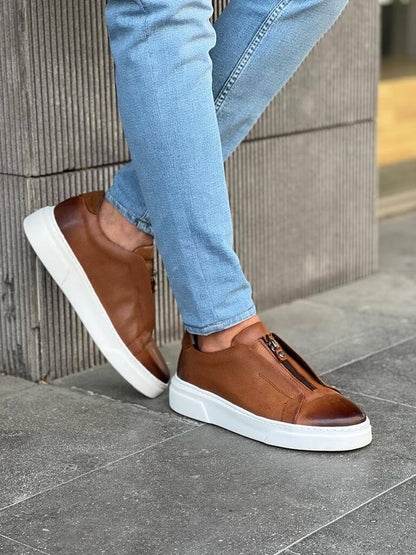 HolloShoe Brown Mid-Top Zipper Slip-Ons for Men – worn by a man in blue jeans, standing, highlighting a sleek and versatile design with a comfortable Eva rubber sole.