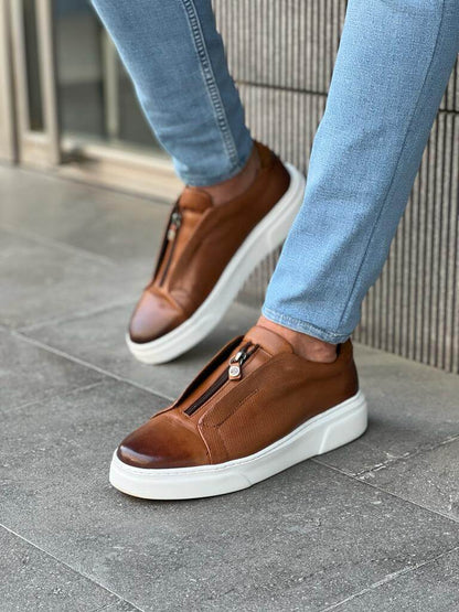 HolloShoe Brown Mid-Top Zipper Slip-Ons for Men – worn by a man in blue jeans, standing, highlighting a sleek and versatile design with a comfortable Eva rubber sole.