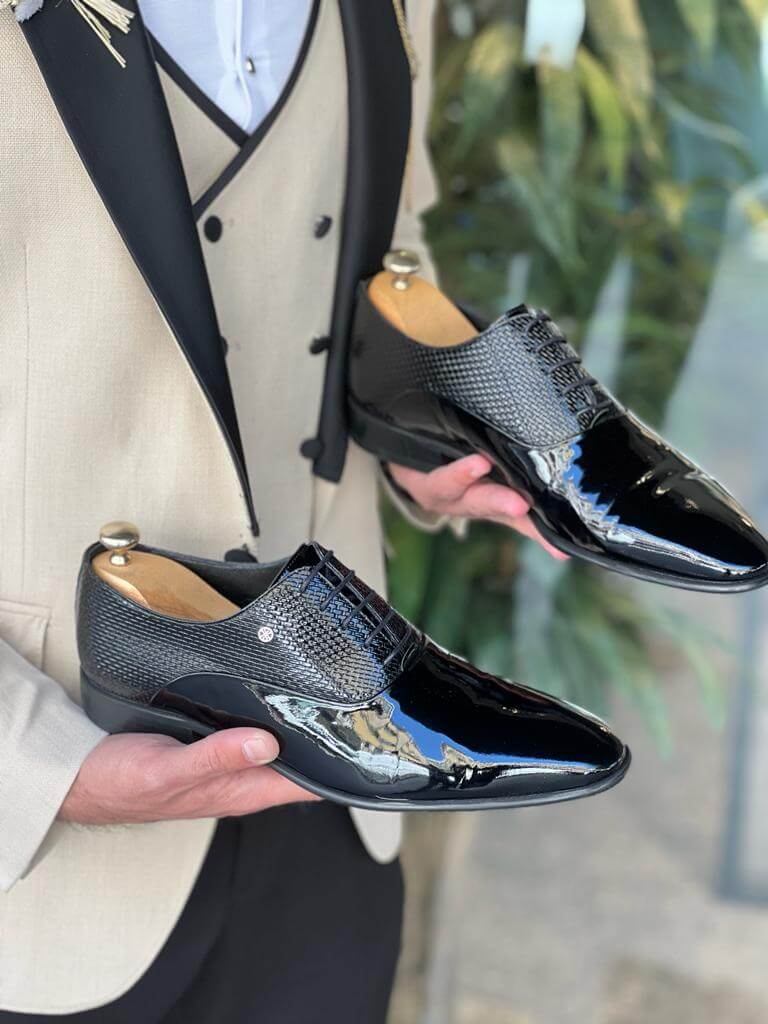 Model showcasing LuxeLace Black Oxfords - premium quality leather dress shoes with a neo-lite sole and a classic lace-up design.