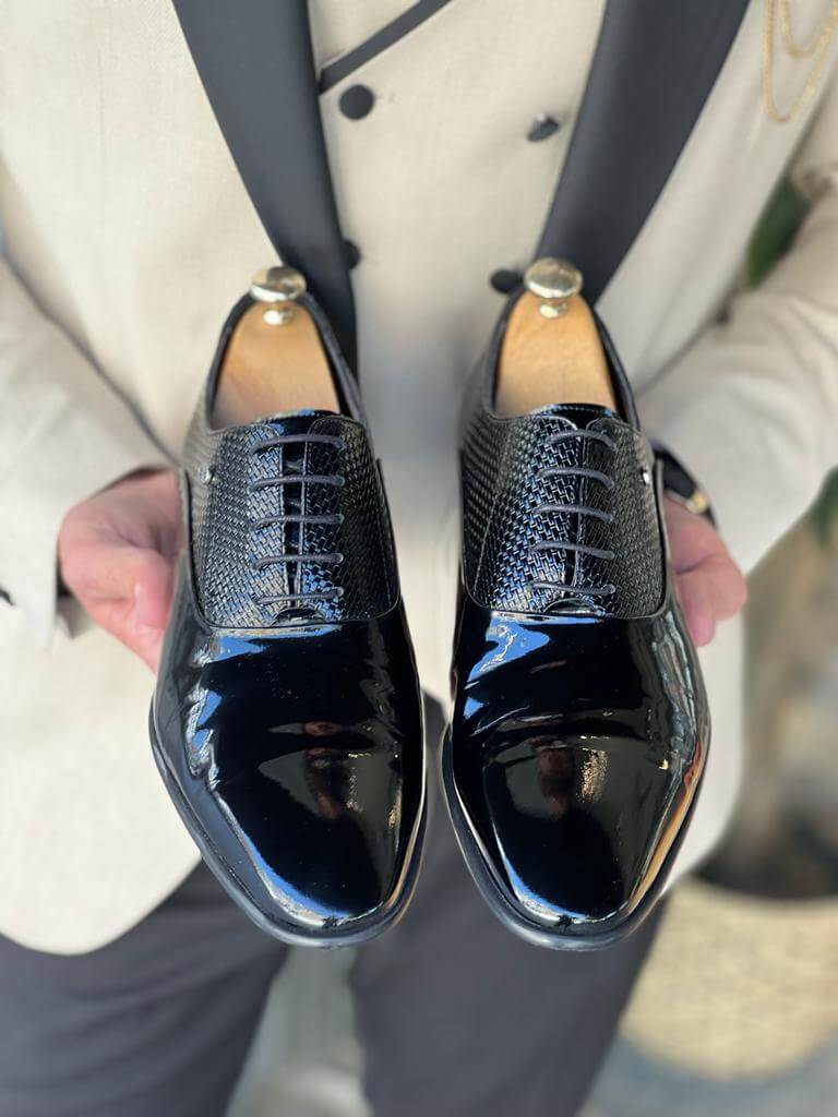 Model showcasing LuxeLace Black Oxfords - premium quality leather dress shoes with a neo-lite sole and a classic lace-up design.