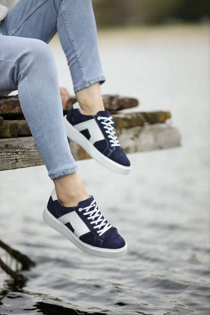 A Navy-Blue Lace Up Sneaker on display.