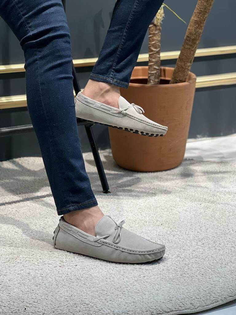 Premium Oakmond Gray Suede Driving Loafers – man casually sitting, highlighting the comfort and versatile style of the gray suede loafers.